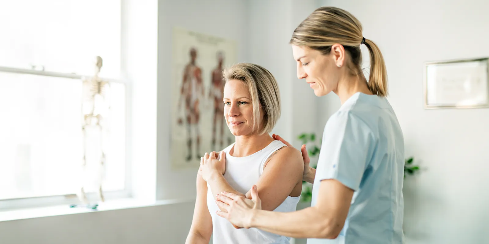 female examine tennis elbow 